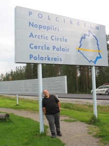 Tony holding up the Arctic Circle sign