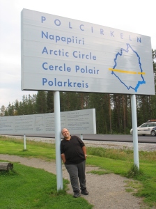 Tony holding up the Arctic Circle sign